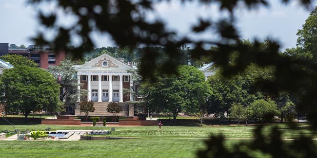 UMD Administration Building seen through trees.